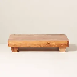 •Raised rectangular trivet in brown •Made with natural acacia wood •Footed base •Helps protect your table...