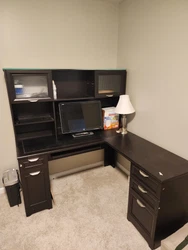 Corner desk with hutch and drawers. Will disassemble prior to pickup. Monitor and lamp not included.