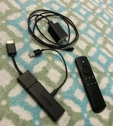 Amazon Firestick with HDMI adapter, remote, and wall plug. Untested.
