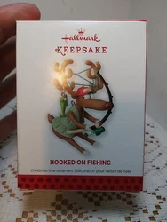 2013 Hallmark Keepsake Ornament Hooked on Fishing Reindeer Tangled Up Rod Reel. PreOwned New Condition Is Perfect Check...
