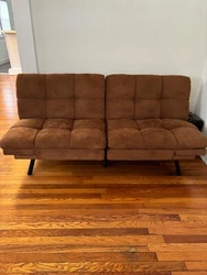 Introducing the Mainstays Memory Foam Futon in Camel Faux Suede Fabric. This stylish and versatile piece of furniture...