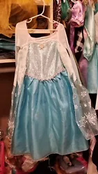 Elsa Dress from Disney Frozen movie. Great quality dress made of durable fabric. Originally purchased from the Disney...