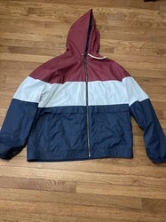 Vintage windbreaker/waterproof jacket. Pre-owned.. Color: Burgundy/Cream white/Navy BlueString to hoodie halfway out.
