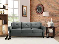 The Lifestyle Solutions Taryn Rolled Arm Sofa upholstered in dark gray fabric is the three seat option of this...