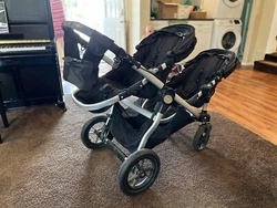 baby jogger city select double stroller, black. fabric bottom storage pouch and back of seat pouches have some...