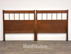 A pair of mid century modern birch twin headboards with polished brass spindles designed by Paul McCobb for Winchendon...