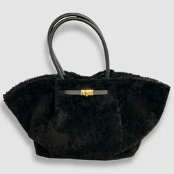 Midi New York Buckle Shearling Tote Bag. Features buckle expandable strap at front. Open top with magnetic closure...