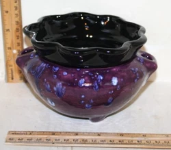 This is a self-watering pot with two holes to fill the base with water. This is an excellent pot for standard size...