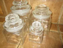 Set of 4 Vintage Dakota Square Glass Apothecary Jars With Ground Glass Lids. In pretty good condition. Largest jar has...