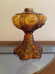 NEW OLD STOCK #2 AMBER COOLIDGE DRAPE OIL LAMP. Approximately 9 1/2” tall and 7 1/8” wide. Reproduction of Antique...