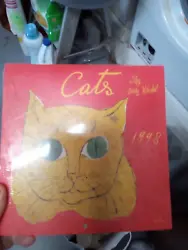 NEW, NEVER USED. Small 1998 Andy Warhol Calendar with pictures of cats.