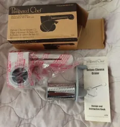 The Pampered Chef Deluxe Cheese Grater 1275. Never used. Product is still in the plastic.