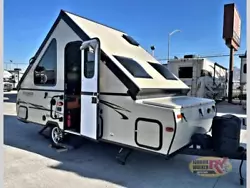 The exterior of the Rockwood Hard Side A124S folding pop-up camper offers front full width storage, exterior storage at...
