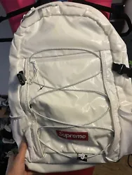 SUPREME FW17 White 3M Reflective Backpack. Faint yellow staining shown in photos. Other then that condition is like...