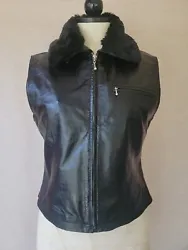 Up for auction is a Womens 100% Leather Black vest.It has zipper for closure  one zippered pocket and buttons...