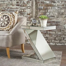 With a mirrored glass finish, this table is both sturdy and unique. No Assembly Required. Includes: One (1) Table....
