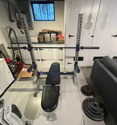 Fully adjustable bench press and squat rack set with weights and 45lb barbell. The weights included are: 3-10lb, 2-...