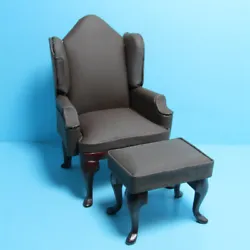 Leather like material with matching ottoman. Beautiful high back chair for your dollhouse. Wood stained mahogany.