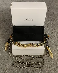 100% Authentic with Dior logo on front. (Note: I added the scarf chain and a woven faux leather gold chain so that you...