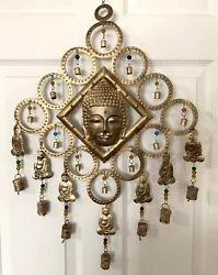 Large Buddha head in center surrounded by bells and beads and 7 dangling small buddhas. Fine condition. All 19 bells...