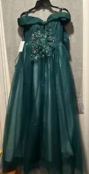 Make a statement in this stunning forest green quinceanera gown from Jeanne Love. The dress features a sweetheart...