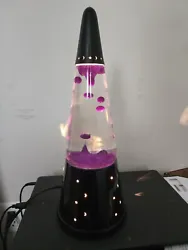 Black Wizard Lava Lamp. White water with purple lava. Used but like new.