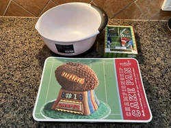 This lot of baking items includes -* Williams-Sonoma Kids Championship Cake Pan (made by Nordic Ware), 10 cup capacity....