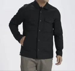 This black Vuori ripstop jacket is a must-have for any stylish mans fall wardrobe. Made from a comfortable cotton...