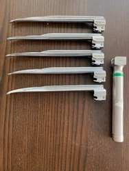 Laryngoscope. SUNMED Greenline Handle and five Medicon blades 45.28.636. Used. Working