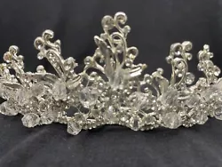 This gorgeous rhinestone tiara features various sizes of sparkling clear rhinestones on silver plating with a loop on...