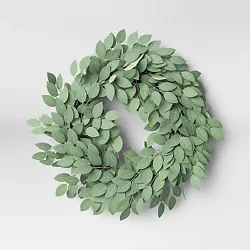 •Green leaf wreath •Wall or door placement •Faux construction •22in diameter  Description  Beautify your front...