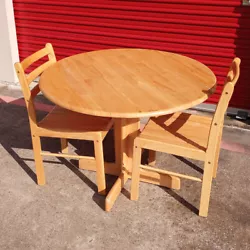 Small solid wood double drop leaf kitchen/dining/breakfast nook set. Set includes one table with two chairs. This...