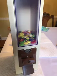 Versavend countertop vending machine candy, gum ball, peanut, other small items. Requires a quarter(coin) insert, turn...