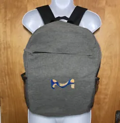 Unisex Gray And Black Backpack. This is a fantastic gray backpack. It has a colorful blue and orange M on the front. It...