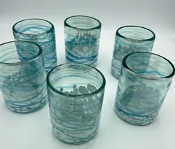 Each piece is made by hand by a local artisan using recycle glass. The artisan take a small piece of the molten glass...