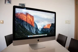 Only iMac and cable, as seen on the photos. iMac 27