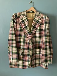 Colors pink, green, blue, yellow and white with back slit, partially lined. Has 2 inside and 2 outside pockets.