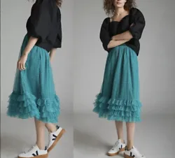 Tiered midi silhouette. Featuring tiers of romantic tulle, this twirl-worthy skirt is sure to make heads turn - just...