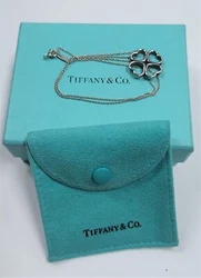 This is a Tiffany & Co. 4 Hearts that from a 4 leaf clover. The Pendant has a 16