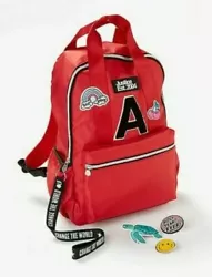 Bold bright red design with fun patch accents and her own initial.
