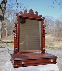 The 1 dovetailed drawer is embellished with glass knobs. The mirror is adjustable and tilts nicely. Elegant and ornate,...