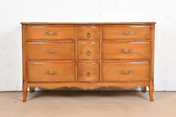 A gorgeous French Provincial Louis XV style nine-drawer dresser or credenza. Carved solid beech wood in provincial...
