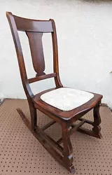 Elegant, antique, rocking chair salvaged from Northeastern Pennsylvania. Its made of solid wood (most likely walnut)...
