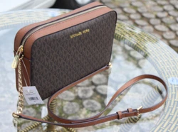 Gorgeous durable PVC MK monogram with leather trim. Water & stain resistant. Adjustable long leather strap with gold...