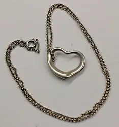 This lovely Tiffany Pendant is the. correct signed Tiffany necklace. heart in heart style. Also has the.