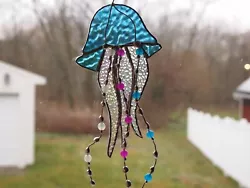 This is a really cool Jellyfish design. This piece is made using a Blue iridescent stained glass combined with a clear...