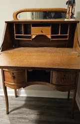 This antique secretary desk is a charming piece of furniture that exudes elegance and style. Made of oak, this...