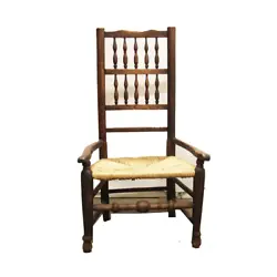 Add comfort to your space with this classic piece. PRODUCT FEATURES Antique wooden reading chair with a short seat and...
