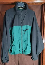 Woolrich Windbreaker. All zippers operate perfectly. Left pocket zipper missing pull cord.