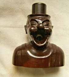 It is out of an early plastic like gutta percha, it is heavy weight. This is a wonderful cigar cutter. You push down...